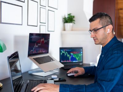 Trader looking at laptops